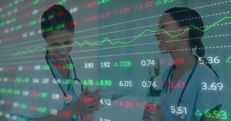 Discussing stock market data, healthcare professionals collaborating in office setting - Powered by Adobe