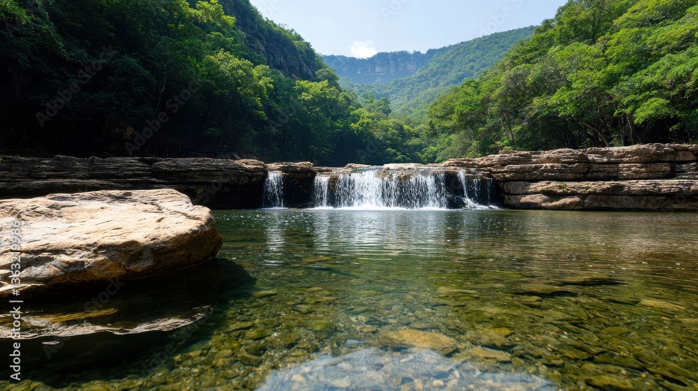 Aufkleber a beautiful waterfall is flowing into a small pool of water