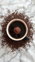 Obraz premium Coffee cup with chocolate truffle surrounded by coffee beans 