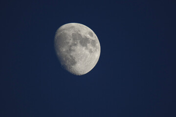 The footage of the full moon in the dark night sky.