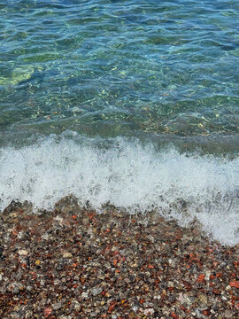 Sea waves on pebble beach