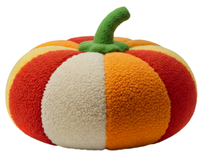 Plush pumpkin-shaped cushion with textured boucle fabric in orange, red, and white stripes