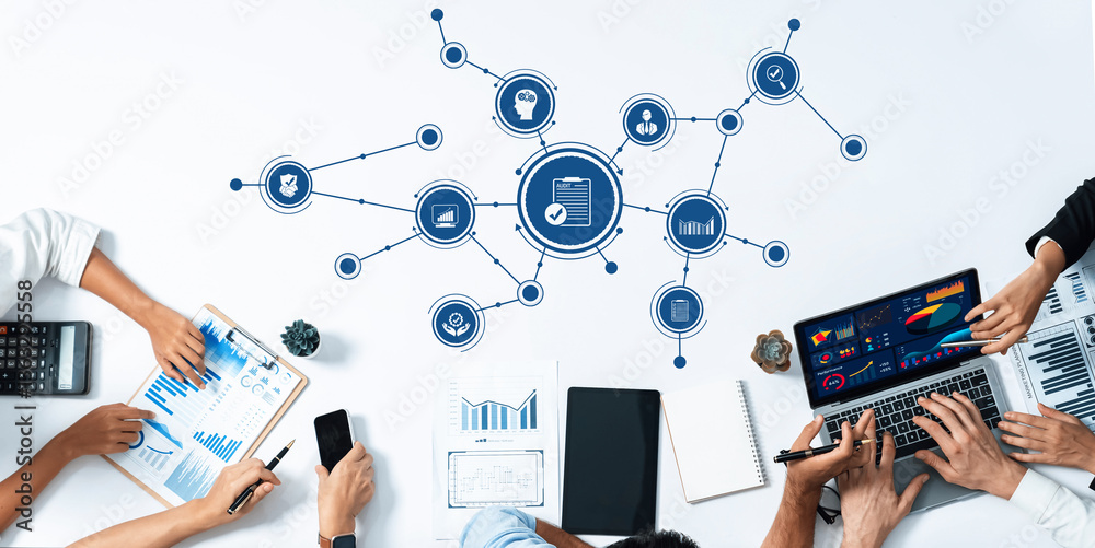 Fototapete a dynamic business meeting scene featuring various digital devices and documents, emphasizing data a