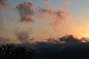 beautiful, cloudy sunrise with wisps of fog