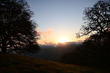 beautiful, cloudy sunrise with wisps of fog