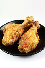 a plate of fried chicken on a white background cutout and isolated on transparent background 