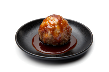 a plate of food with a meat ball on it cutout and isolated on transparent background 