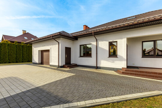 Modern House with Garage and Paved Yard