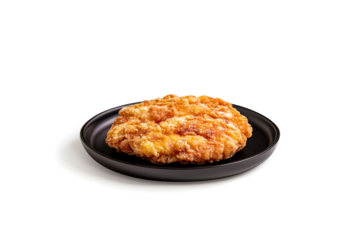 a black plate with a fried chicken on it cutout and isolated on transparent background 