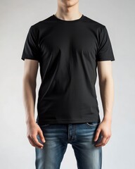Obraz premium Man Wearing Black T-shirt and Jeans on Neutral Background Studio Shot