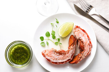 Delicious boiled lobster served on white table, flat lay
