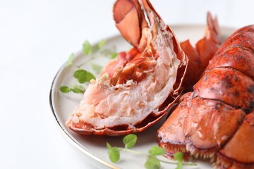 Delicious tails of boiled lobsters served on white table, closeup