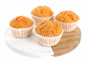 Tasty sweet carrot muffins isolated on white