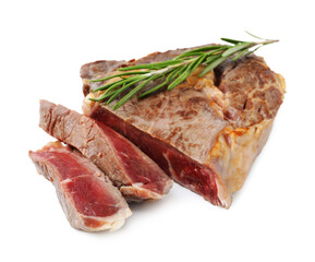 Pieces of delicious beef meat and rosemary isolated on white