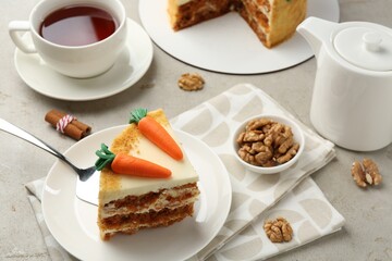 Delicious homemade carrot cake served on light grey table