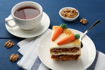 Delicious homemade carrot cake served on blue wooden table