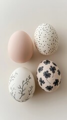 Decoratively painted eggs displayed on a neutral background during springtime festivities