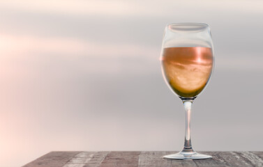 Glass of white wine on wooden table in sky background