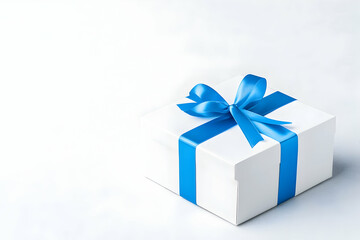 Fototapeta premium White gift box with a blue ribbon bow on a white background