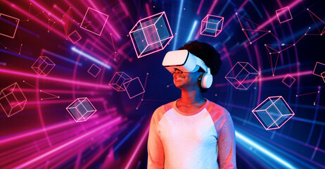 Girl looking around at geometric shape floating in metaverse. Happy teenager or gamer using VR headset and augmented reality technology accessing virtual world. Technology innovation. Ingenuity.