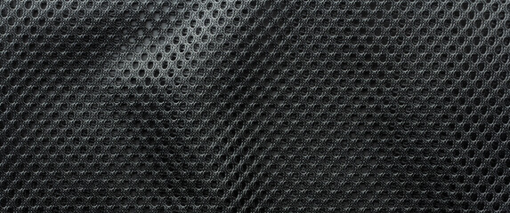 Close-up of mesh fabric with a wavy surface, a material widely used in athletic apparel