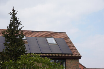 solar panels on rooftop of family home. Alternative energy source. solar power 