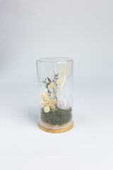 vase with dried flowers and a snail