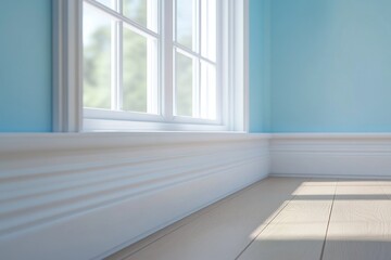 White baseboard molding in a bright room with sunlight streaming through a window.