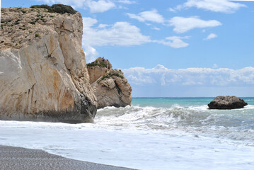 landscape photo, sea waves crashing against a rocky shore