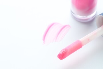 Moisturizing lip balm and applicator on white background, closeup. Space for text