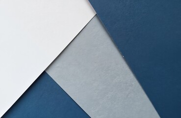Geometric paper background with navy blue grey and white shades. Macro photography of abstract structure design. Textured surface, crafted for design, art projects. Clean lines, modern graphic.