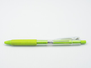 Green plastic ballpoint pen isolated on white background