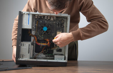 Caucasian master repairing computer. Computer maintenance