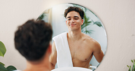 Man, confident or mirror for body in home with results, face reflection and grooming in morning. Good mood, facial glow and male person in house bathroom with proud smile, towel and skincare hygiene © peopleimages.com