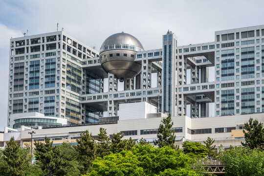 Tokyo, Japan - April 30, 2024: Futuristic Fuji TV HQ in Odaiba. Completed in 1996 by Kenzo Tange, it features a large sphere acting as an observation deck. A stunning example of modern architecture.