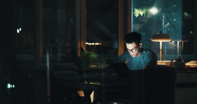 Overtime, late or man on tablet for startup report, post deadline or online update research. Engagement, night or content strategist on technology for digital marketing trends or social media growth