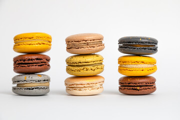 Multicolored macaroons on a white background.