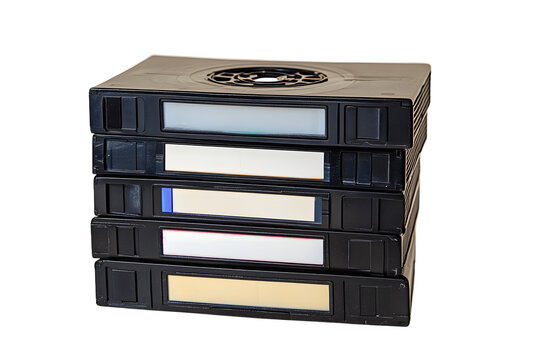 A stack of vintage VHS video tapes with blank labels, isolated on a white background, showcasing retro technology for recording and watching movies at home.