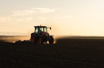 Tractor preparing the land for a new crop planting