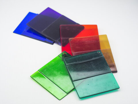 Various colors of clear color chips isolated on white background, color samples of plastic products produced by masterbatch