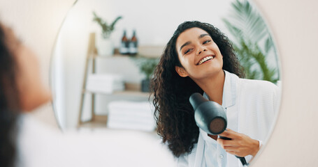 Mirror, woman and hair care with blow dryer for frizz control, heat treatment and smile for daily...