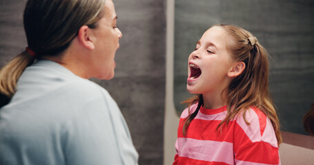 Mother, girl and check for cavity, dental hygiene and wellness with fresh breath, remove plaque and family. Parent, mama and kid with open mouth, oral health and routine with teeth whitening or home