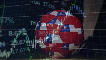 Overlaying financial stock market graphs, soccer ball with American flag design - Powered by Adobe