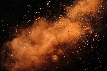 Fototapeta premium Orange powder explosion against a transparent background, creating a dramatic and textured image.