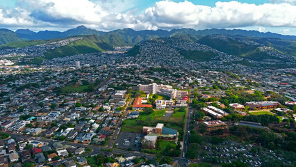 Aerial View of Honolulu Neighborhoods and Mountains. Wide aerial view of residential neighborhoods...