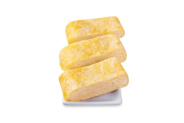 Tamagoyaki, asian omelette roll in a plate on a white isolated background
