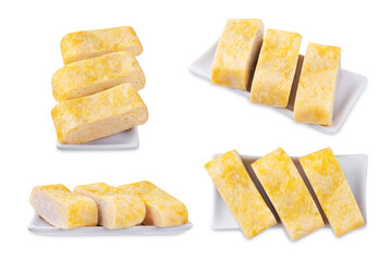 Tamagoyaki, asian omelette roll in a plate on a white isolated background