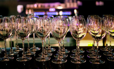 Elegant setup of wine glasses at a modern bar ready for a lively evening gathering