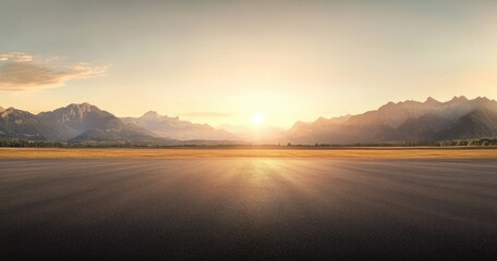 Empty asphalt runway extending into a majestic mountain landscape at sunrise