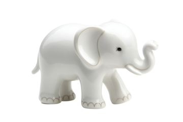 White porcelain elephant with raised trunk sculpture against black background, cut out